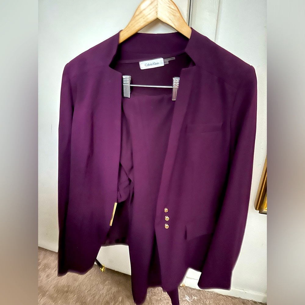 Selling an excellent condition purple Calvin Klein pants suit.